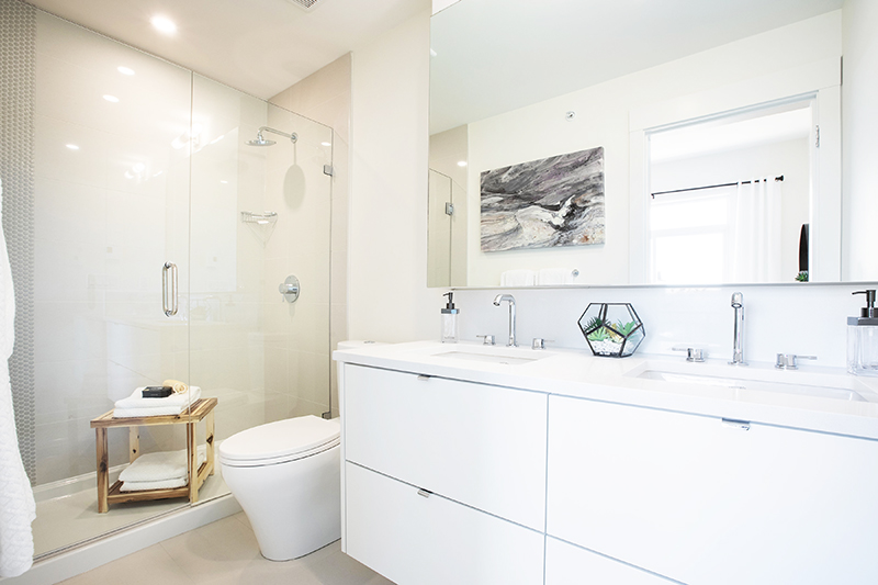 Bathroom with double sinks and shower